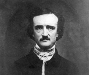 foto em preto e branco. Allan Poe com terno esc uro e colarinho e gravata brancos